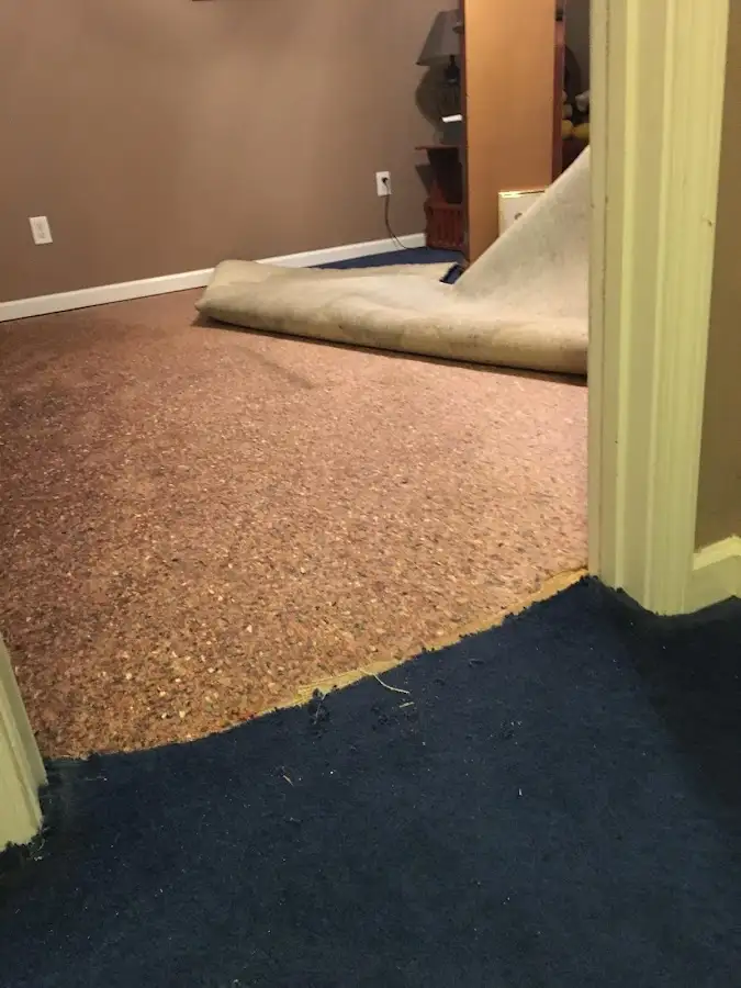 Carpet pad removal revealing water damage during Drying & Dehumidification in Valley